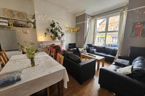 A bright and inviting living room with comforta...