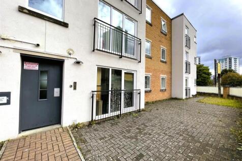 Modern exterior with large windows and balconie...