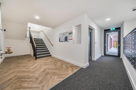 Modern entrance hall with stylish flooring...
