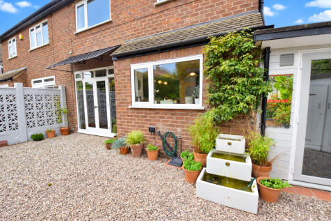 Sunny Brick Courtyard with Fountain