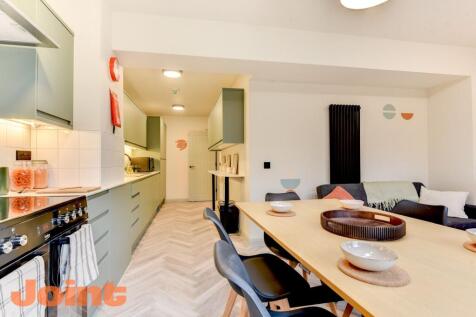 Modern open-plan kitchen and dining area...