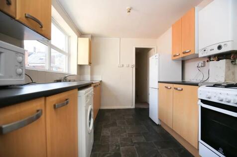 Bright kitchen with ample storage and appliance...