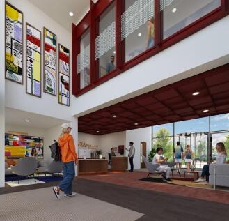Bright, double-height communal lounge with mode...