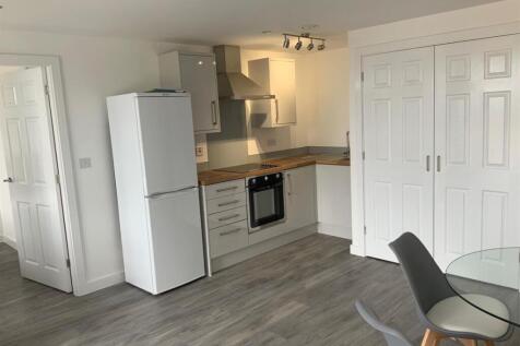 Bright modern kitchenette with dining area...