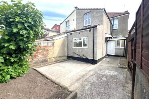 Well-maintained rear exterior area with paved s...
