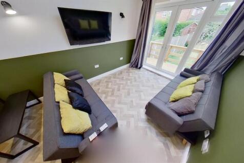 Bright lounge with garden access and large TV...