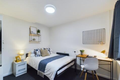A bright and inviting double bedroom featuring ...