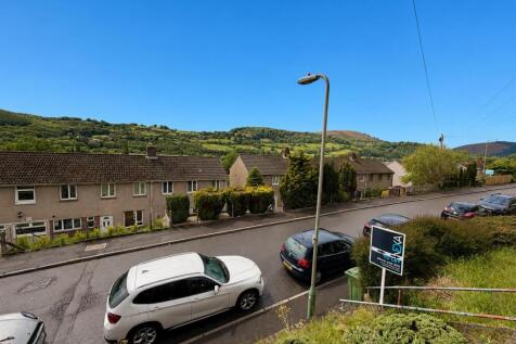 Bright street scene with beautiful hillside vie...