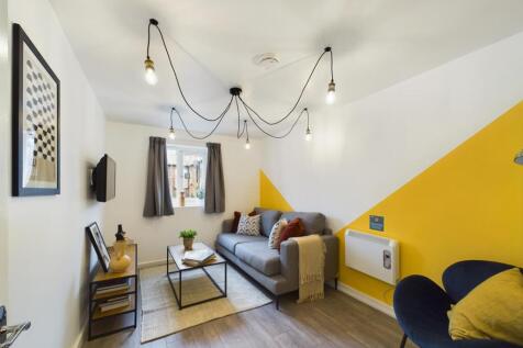 Bright and welcoming modern living room featuri...