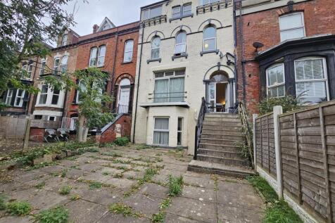 Exterior view of a charming terraced house feat...