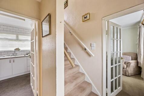 Stairs rising to First Floor