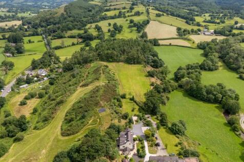 Farmhouse, cottage and 18 acres to include woodland.
