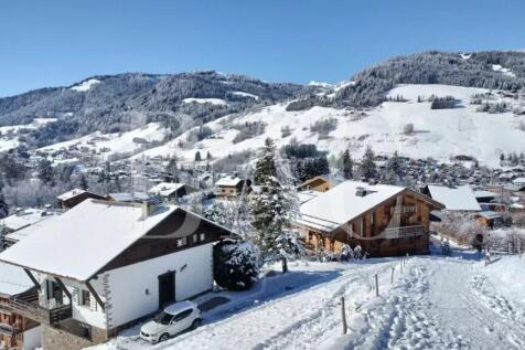 A picturesque winter scene featuring snow-covered 