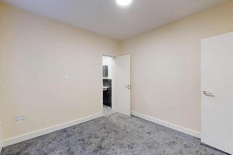 Neat, freshly decorated bedroom with neutral wa...