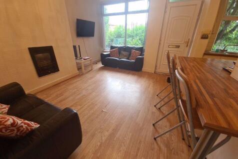 Bright and welcoming living room featuring comf...