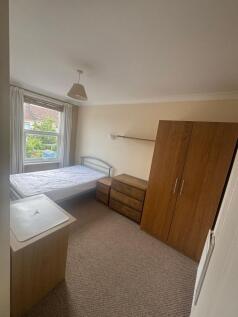 Bright double bedroom with ample storage space...