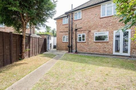Private rear garden with a paved pathway, lawn ...