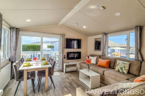 Bright open-plan lounge and dining area inside the