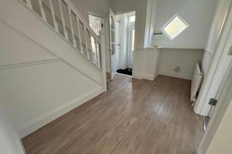 A bright and inviting hallway with modern decor...