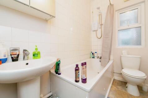 Bright and functional bathroom with a bathtub a...