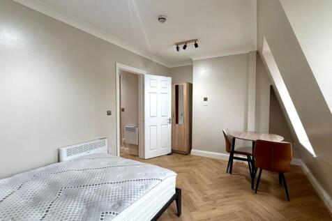 Bright, freshly painted double bedroom with her...