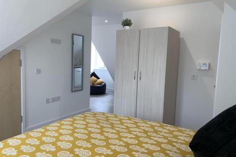 Bright modern bedroom with ample storage space...
