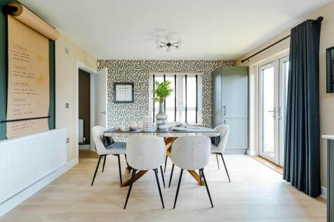 Double doors lead from the dining area to the garden, perfect for alfresco dining