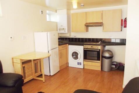 Bright kitchen with modern appliances and dinin...