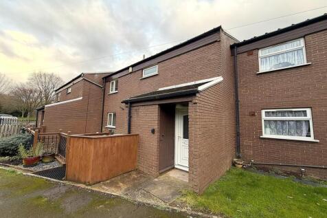 Charming brick exterior with neat front garden...