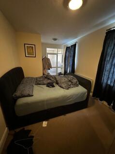 Comfy double bedroom with a plush storage bed...