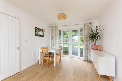 KITCHEN SITTING ROOM AND DINING ROOM