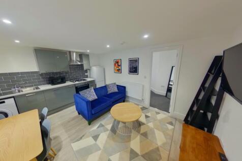 A spacious and inviting modern living room feat...