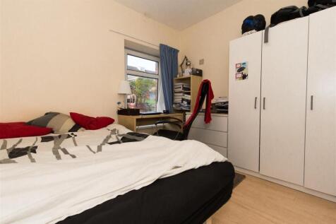 Bright bedroom with ample storage and desk spac...