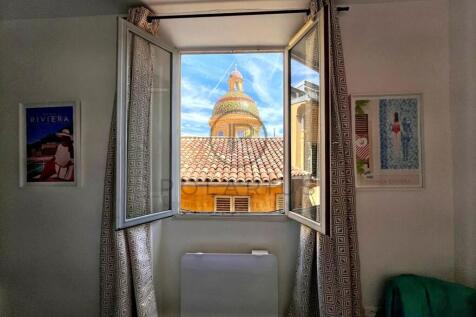 Bright living space with a charming view of a hist
