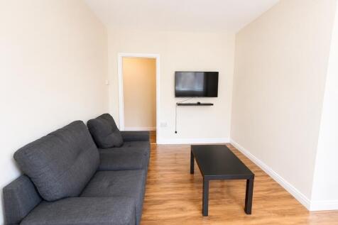 Bright living room with comfy sofa and smart TV...