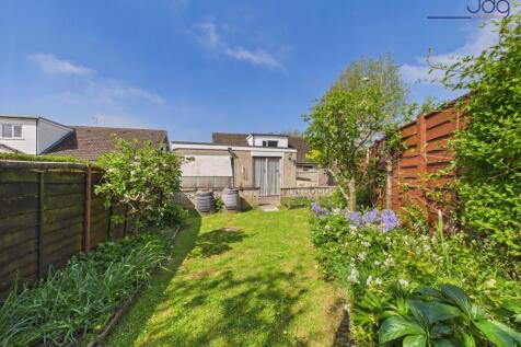 Private, well-established garden with lawn, patio seating and space to grow