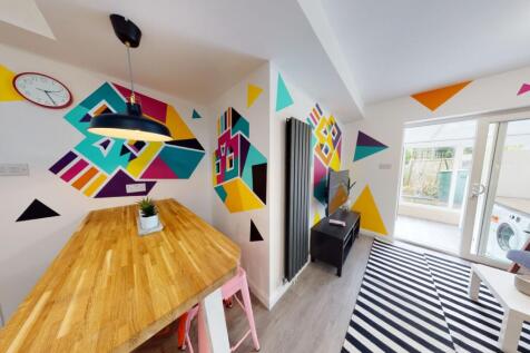 Bright, modern living space with bold geometric...