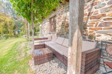 Outside seating under the grape vine