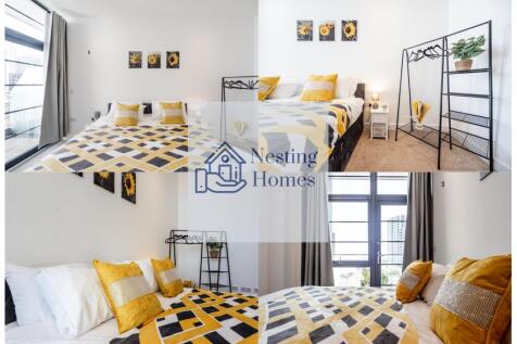 Bright and welcoming master bedroom featuring a...