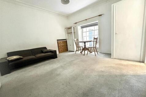 Spacious living area with bright natural light...
