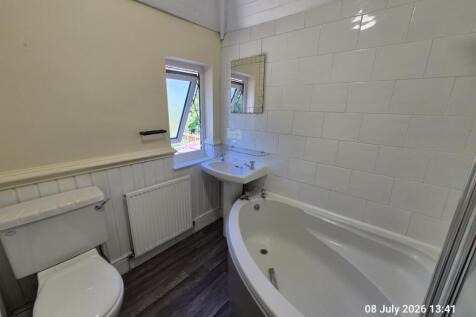 Bathroom with shower over the bath 