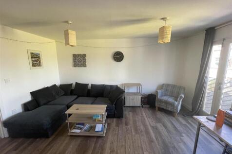 Spacious lounge with a large comfy corner sofa...