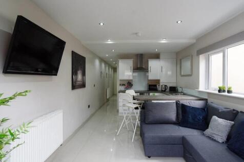 Modern open-plan living with sleek finishes and...