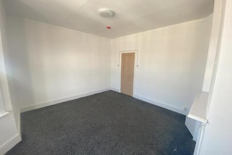 A bright and spacious hallway with potential fo...