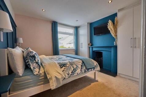 BEDROOM ONE TO FRONT