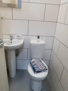 Bright, recently tiled bathroom with a modern p...