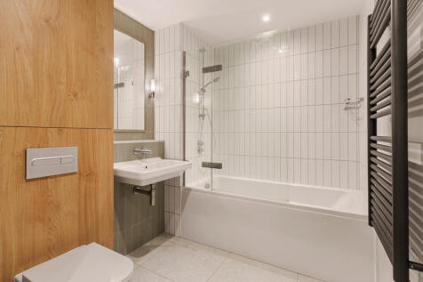 Experience luxury in this elegant bathroom designed with a blend of modern and natural elements.