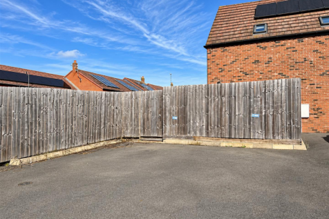 Sunny Suburban Driveway and Fence.png