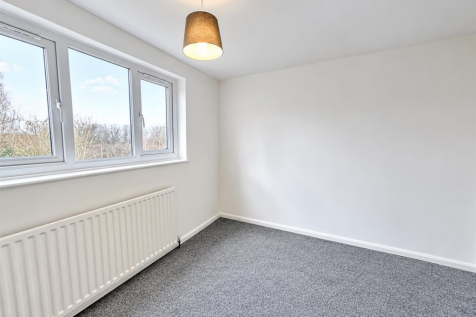 Minimal White Room with Windows and Radiator.png