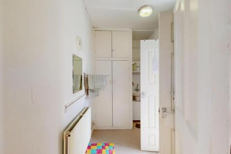 Bright hallway with useful built-in storage....